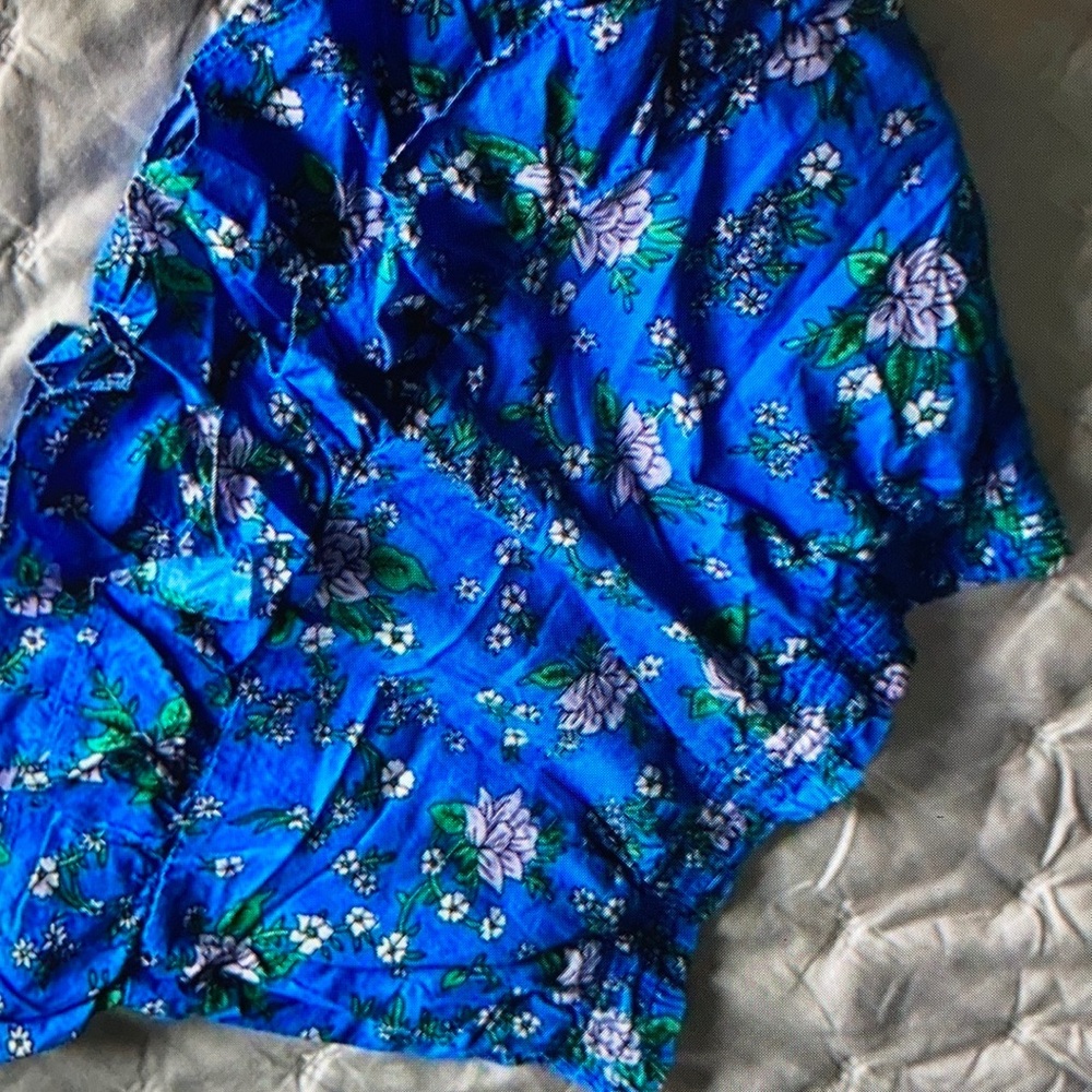 Features delightful ruffle floral design skorts